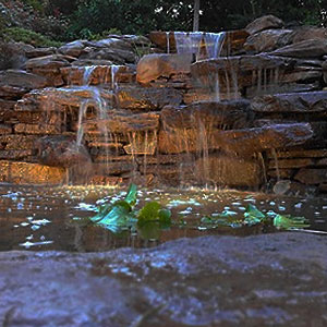 Custom waterfall with underwater lights Pondscapes Maryland