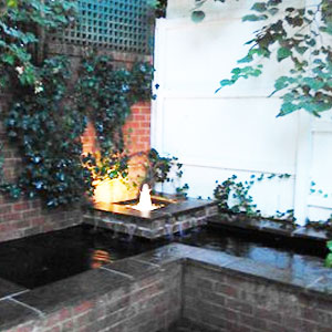Corner formal pond with fountain -  Pondscapes Maryland