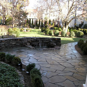 Rock wall with waterfall, pond and patio - Pondscapes Maryland