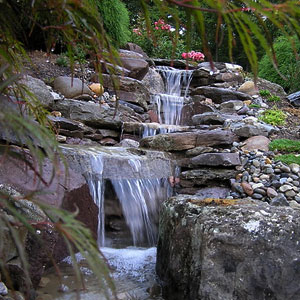 backyard pond sanctuary with a waterfall Pondscapes Maryland